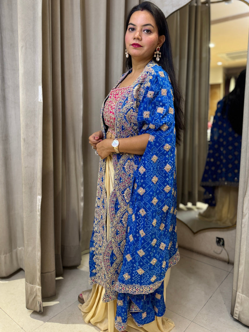 Golden Dhoti set with Rani color Blouse and heavy bandhani Royal Blue shrug