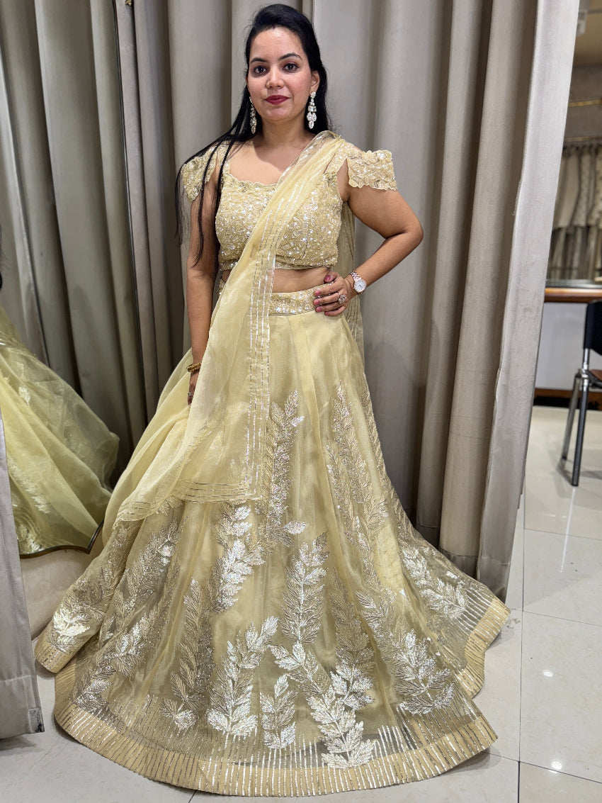 Golden designer lehenga having gota work on skirt and hand embroidery on blouse