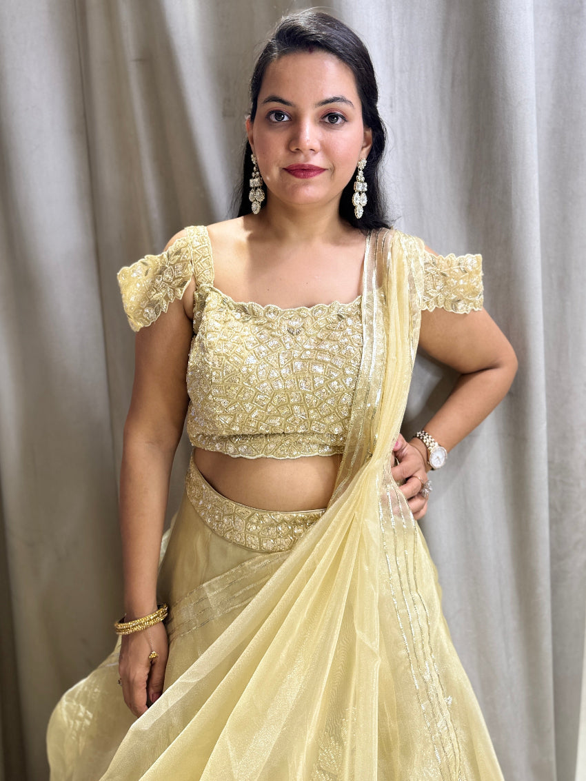 Golden designer lehenga having gota work on skirt and hand embroidery on blouse