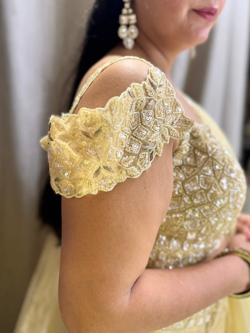 Golden designer lehenga having gota work on skirt and hand embroidery on blouse