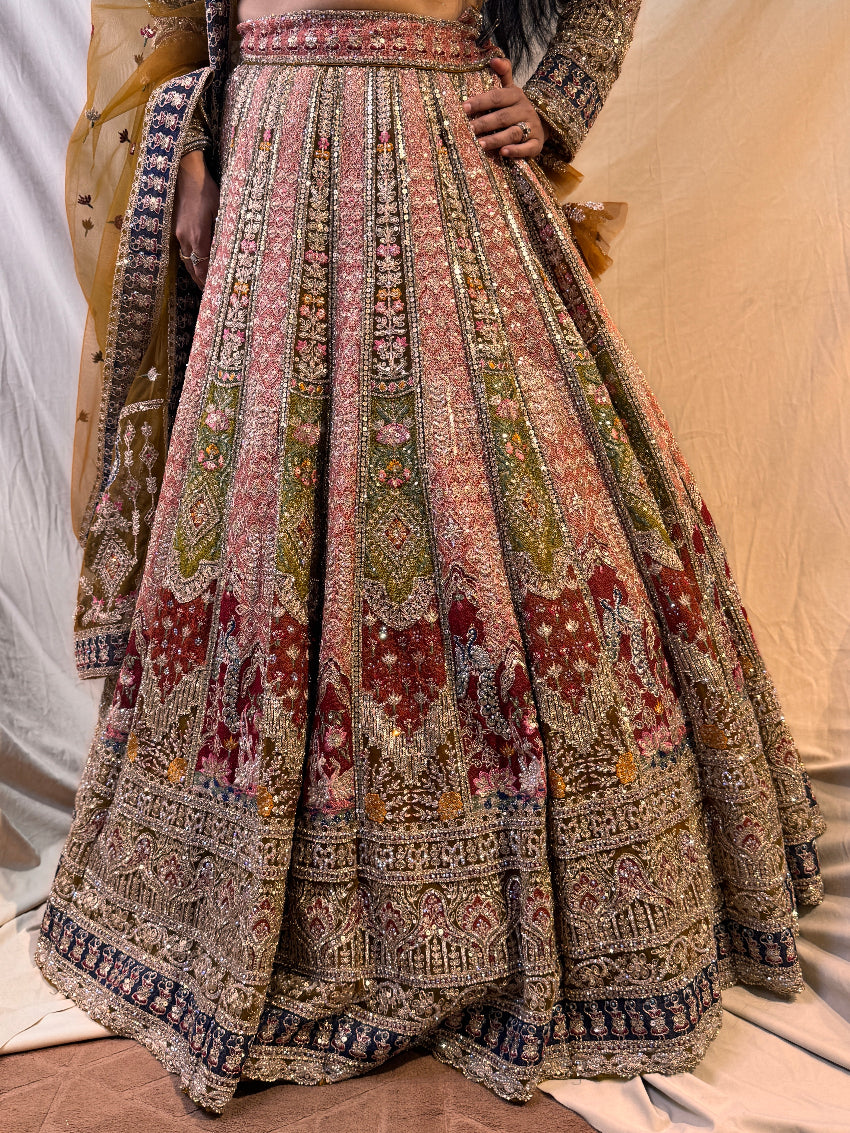 Traditional embroidered lehenga with intricate patterns on a neutral background