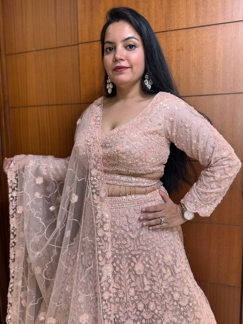 Woman wearing a traditional embroidered outfit with a wooden panel background