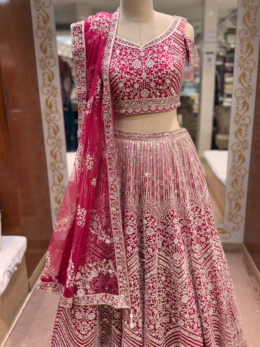 Rani pink Heavy Embroidered lehenga with mirror and sequin detailing