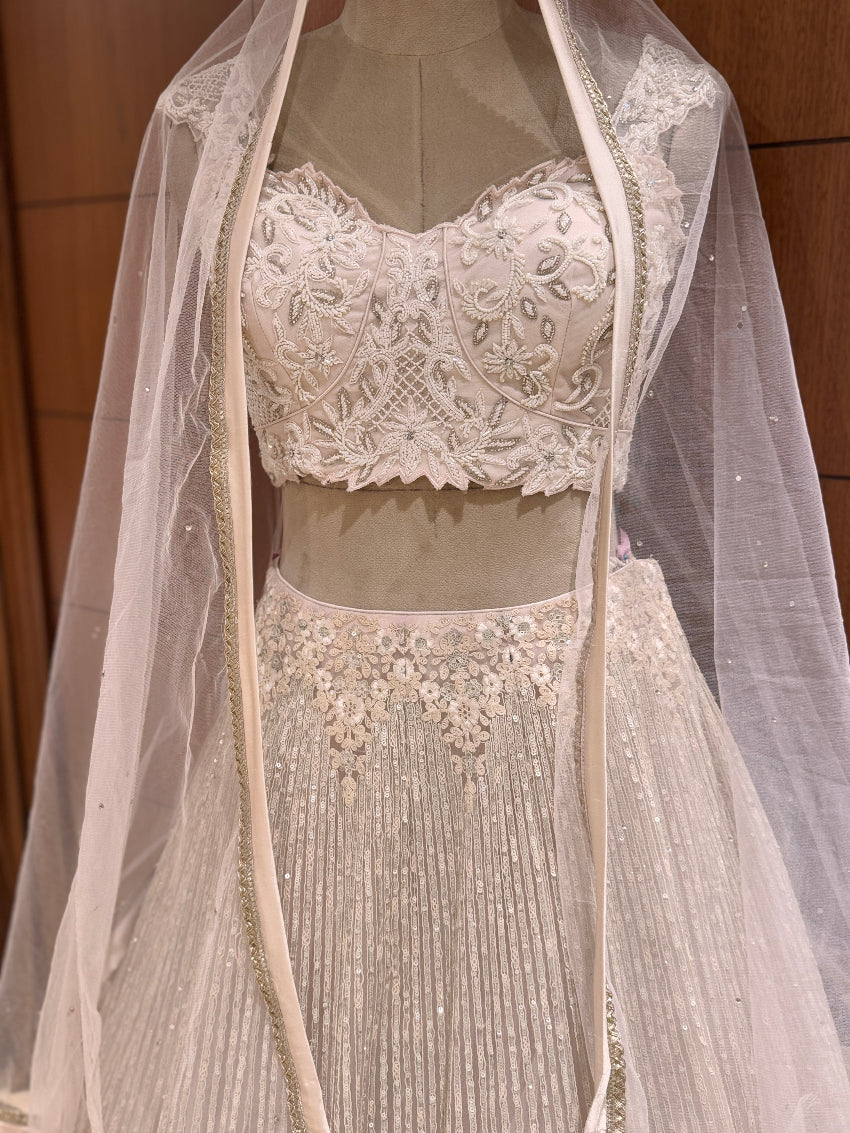 Ivory heavy embroidered designer lehenga with sheer dupatta