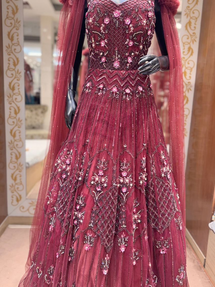 Maroon hand embroidered designer gown with cape sleeves