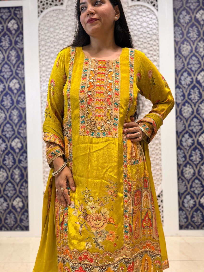 Greenish yellow printed crepe suit with intricate hand work detailing