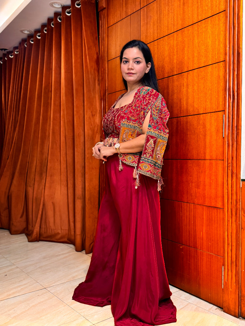 Maroon Indo-Western with heavy embroidery on bustier and multi color shrug