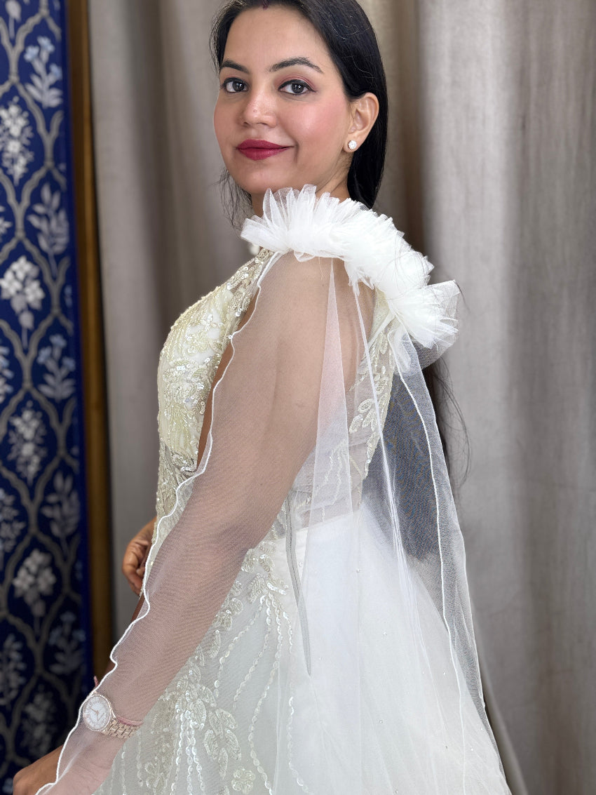 Ivory ball gown with designer hand embroidery and long net cape sleeves with frill shoulder
