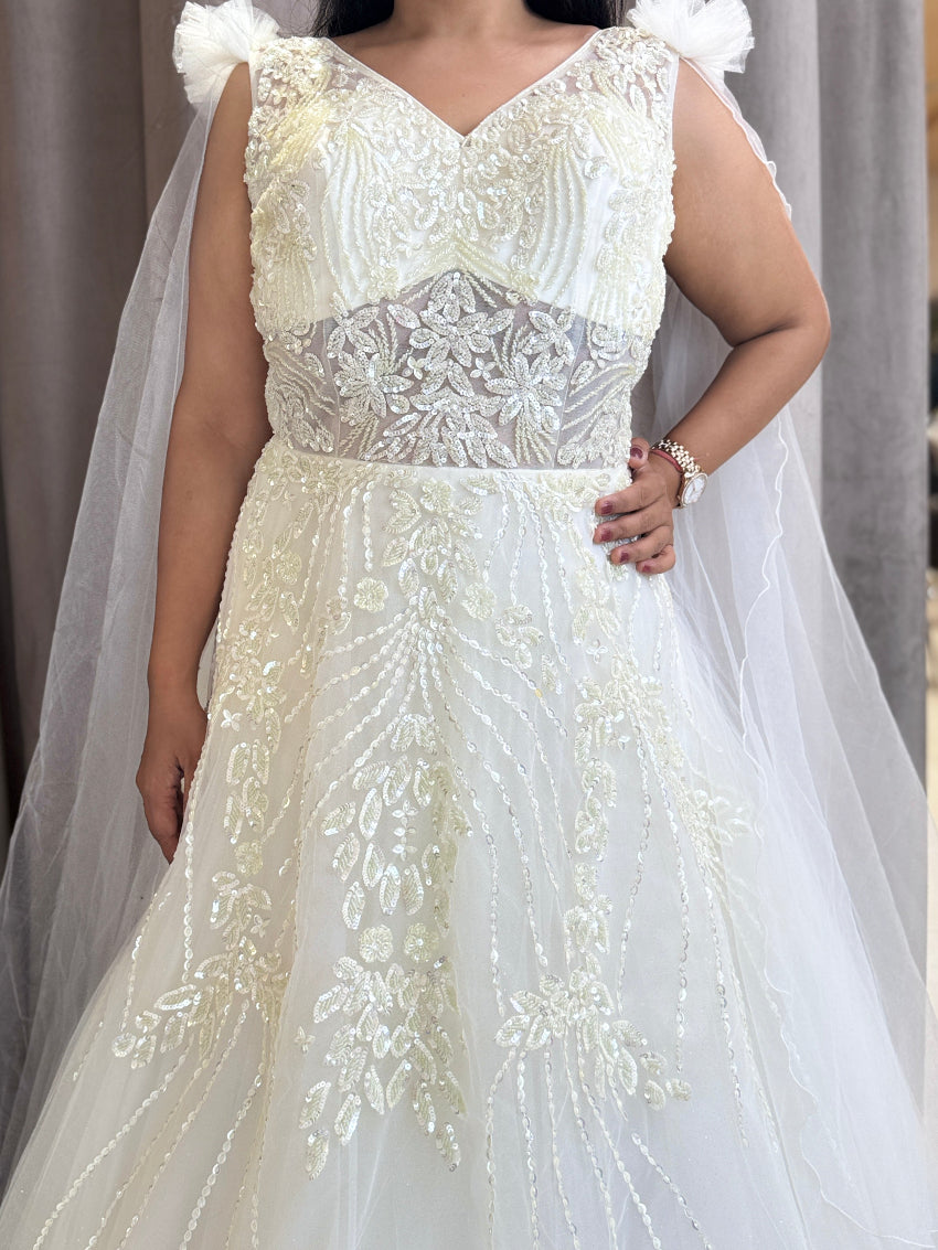 Ivory ball gown with designer hand embroidery and long net cape sleeves with frill shoulder