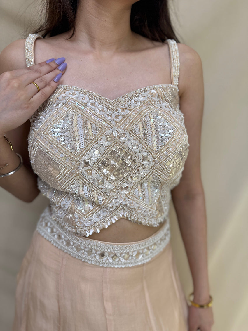 Kiara Advani inspired Ivory colored Hand embroidered Indo-Western lehenga.