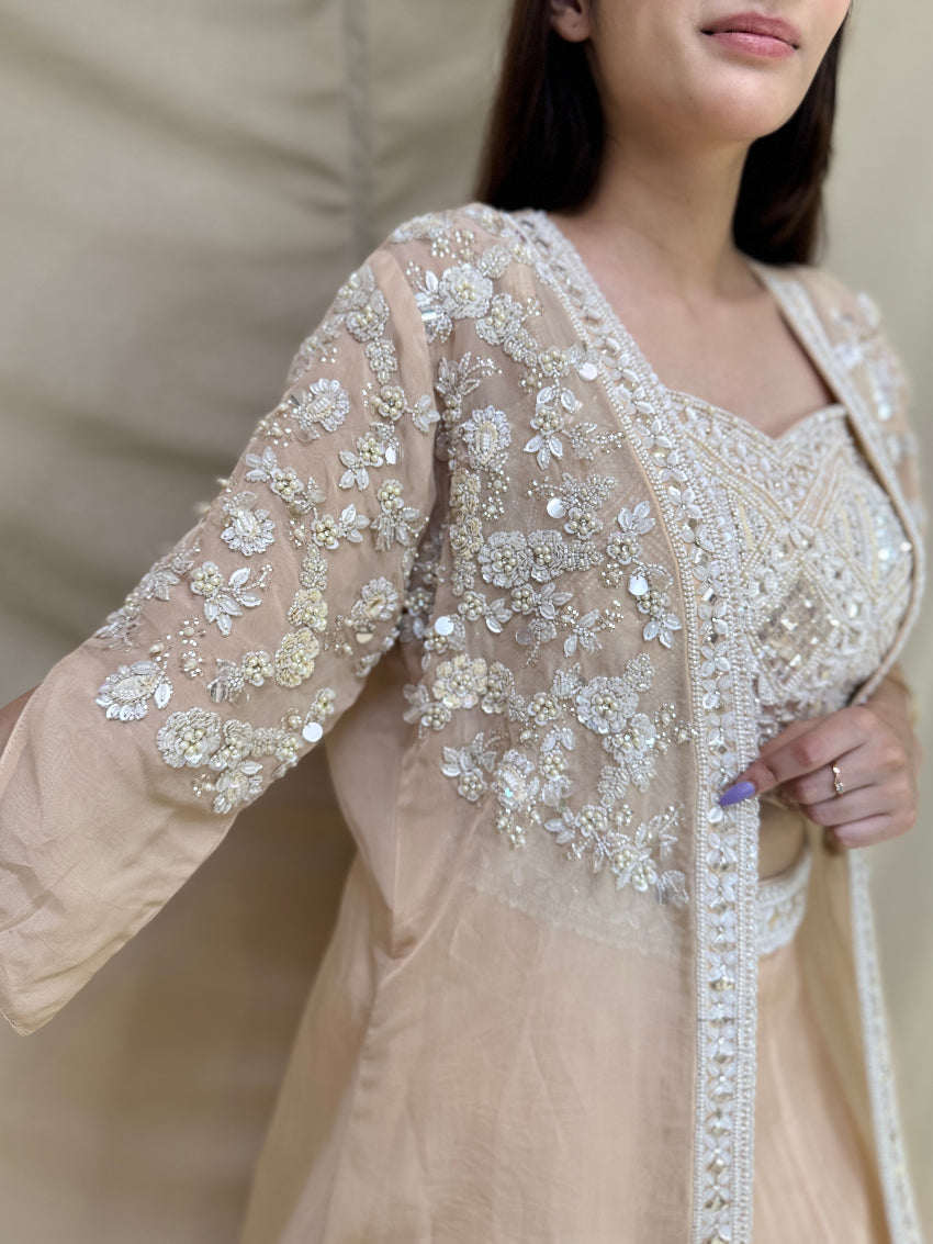 Kiara Advani inspired Ivory colored Hand embroidered Indo-Western lehenga.