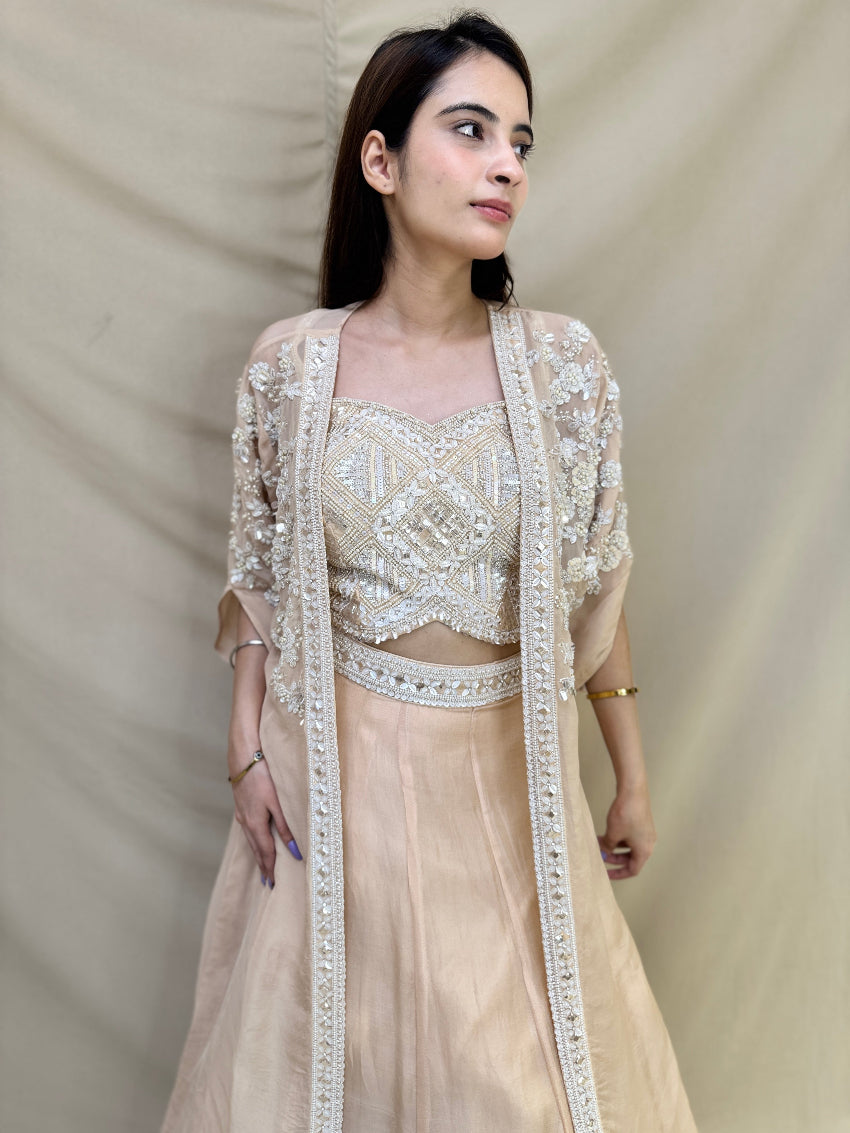 Kiara Advani inspired Ivory colored Hand embroidered Indo-Western lehenga.