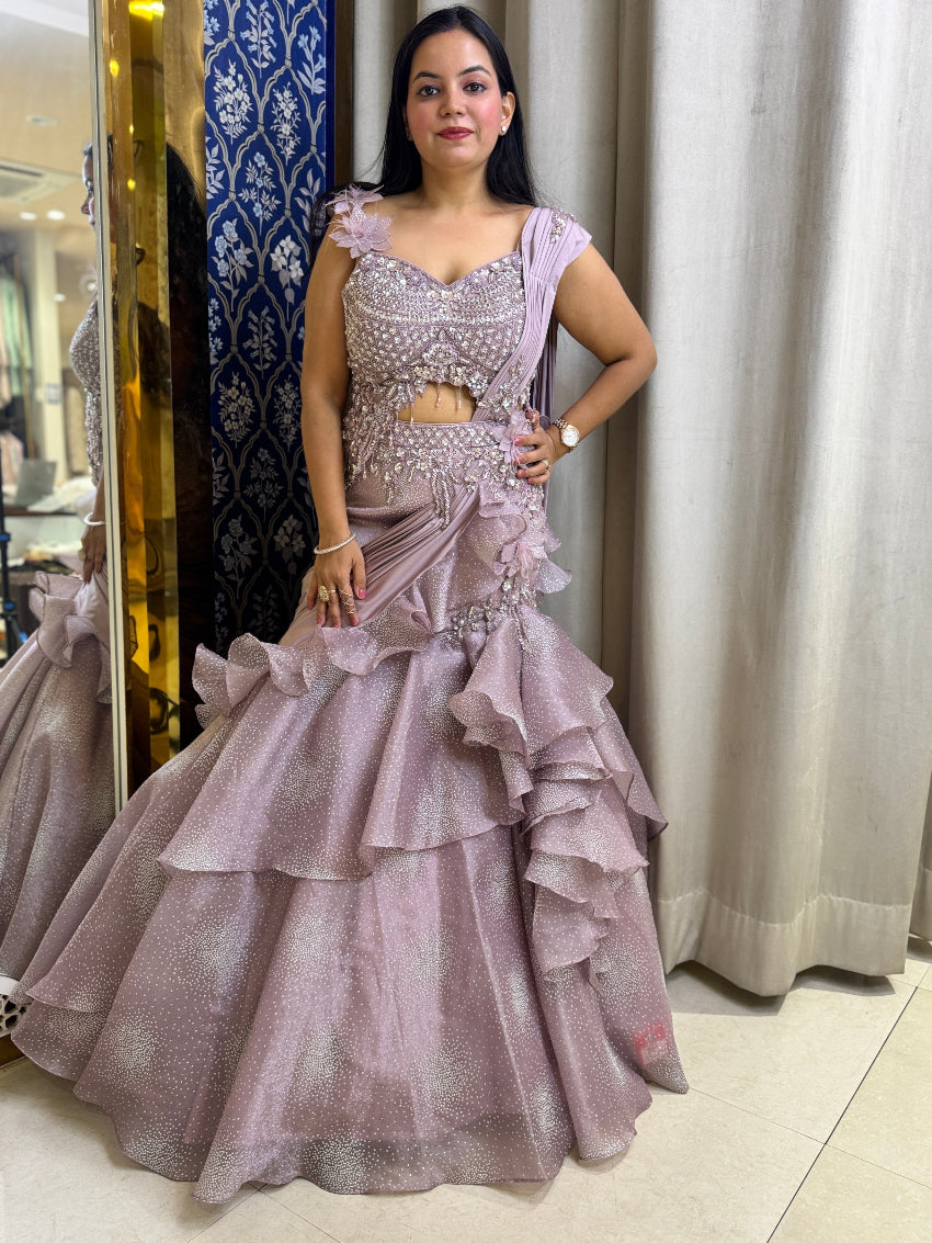 Purple color fish cut lehenga with layers and hand embroidered blouse with tassels