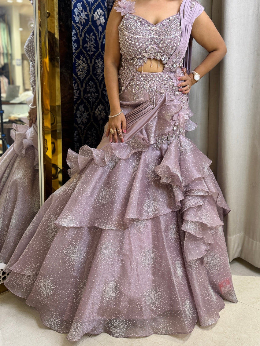 Purple color fish cut lehenga with layers and hand embroidered blouse with tassels