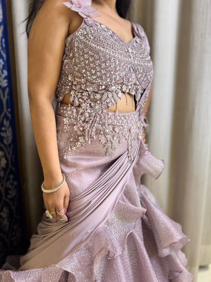 Purple color fish cut lehenga with layers and hand embroidered blouse with tassels