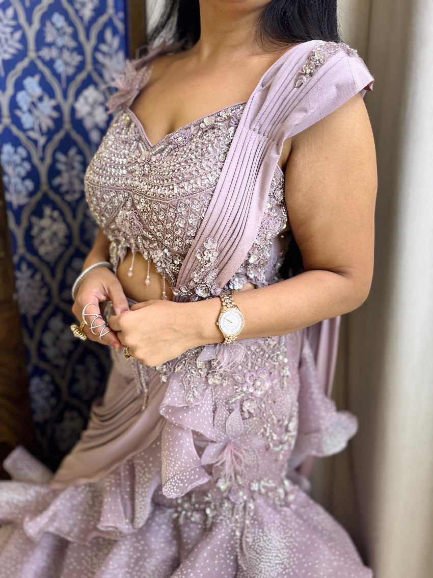 Purple color fish cut lehenga with layers and hand embroidered blouse with tassels