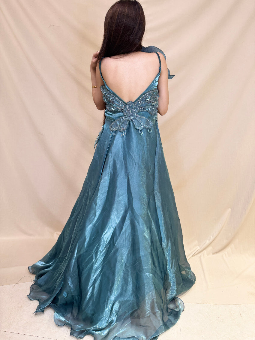 Turquoise Blue party wear gown in cosmos fabric and detailed with stones, cutdana and sequin.