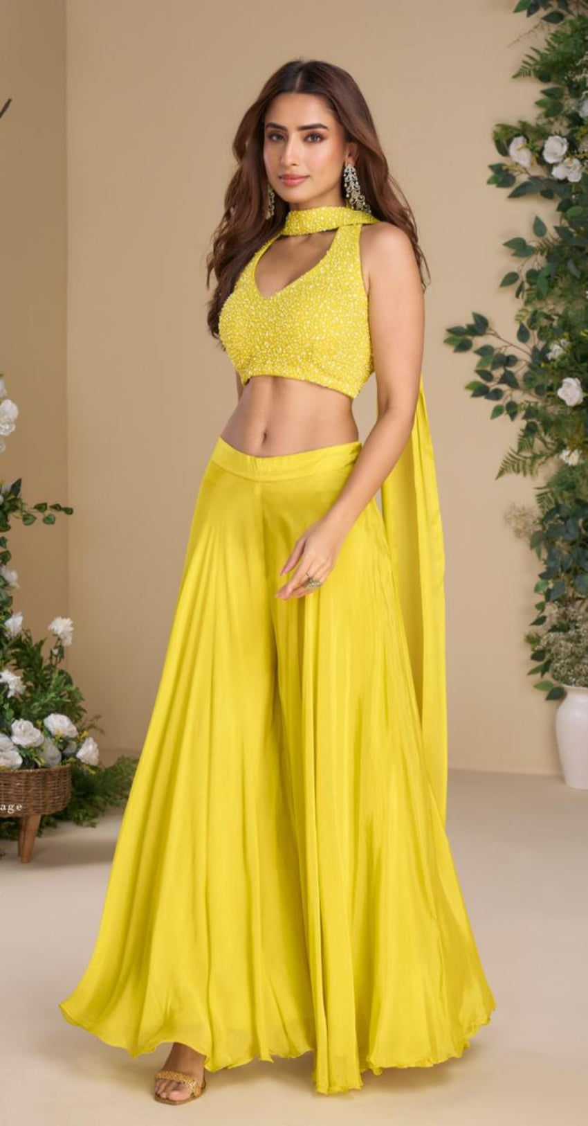 Woman wearing a yellow outfit with a beige background