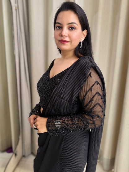 Black drape saree with heavy hand embroidered net blouse and imported  pleated fabric of saree.