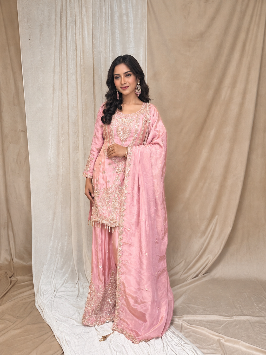 Blush pink heavy Sharara Set having intricate hand detailing of pearls, sequin,  kut Dana with  pearl tassels on kurta  and heavy border dupatta with tassels
