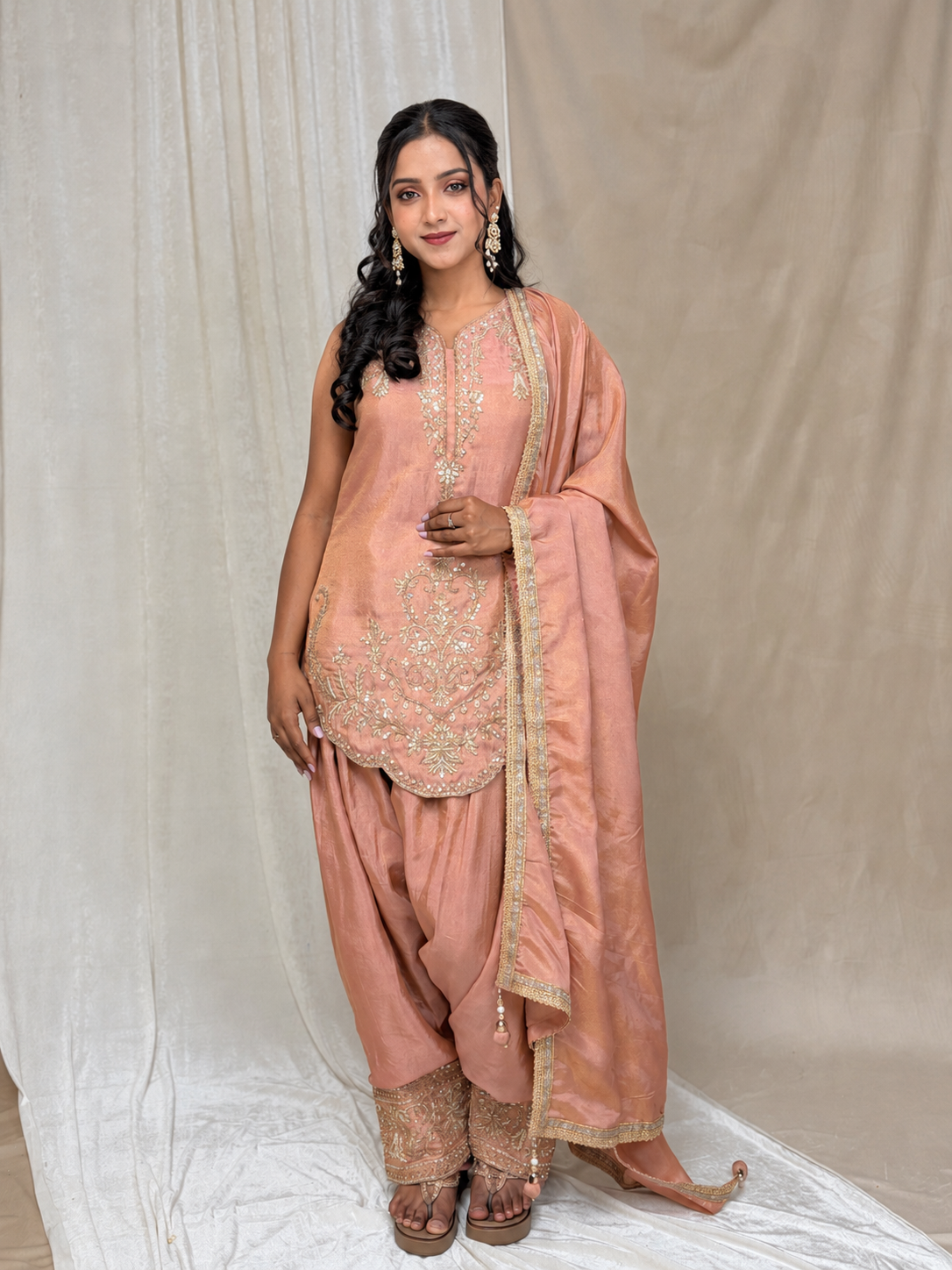 Peach Stylish Salwar suit set with intricate detailing of beads, Zari and sequins and lace dupatta