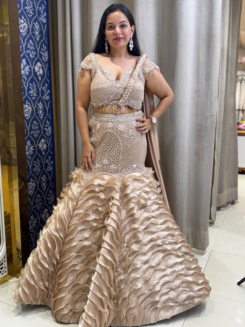 Golden designer fish cut lehenga with braided dupatta