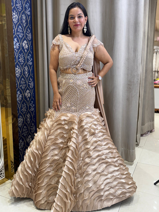Golden designer fish cut lehenga with braided dupatta
