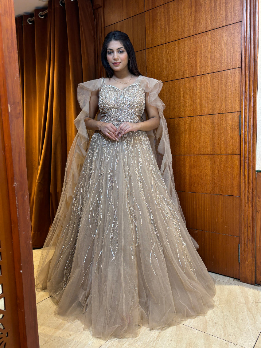 Champagne gold premium hand-embellished engagement gown with ruffle cape style sleeves and rope tie backless pattern