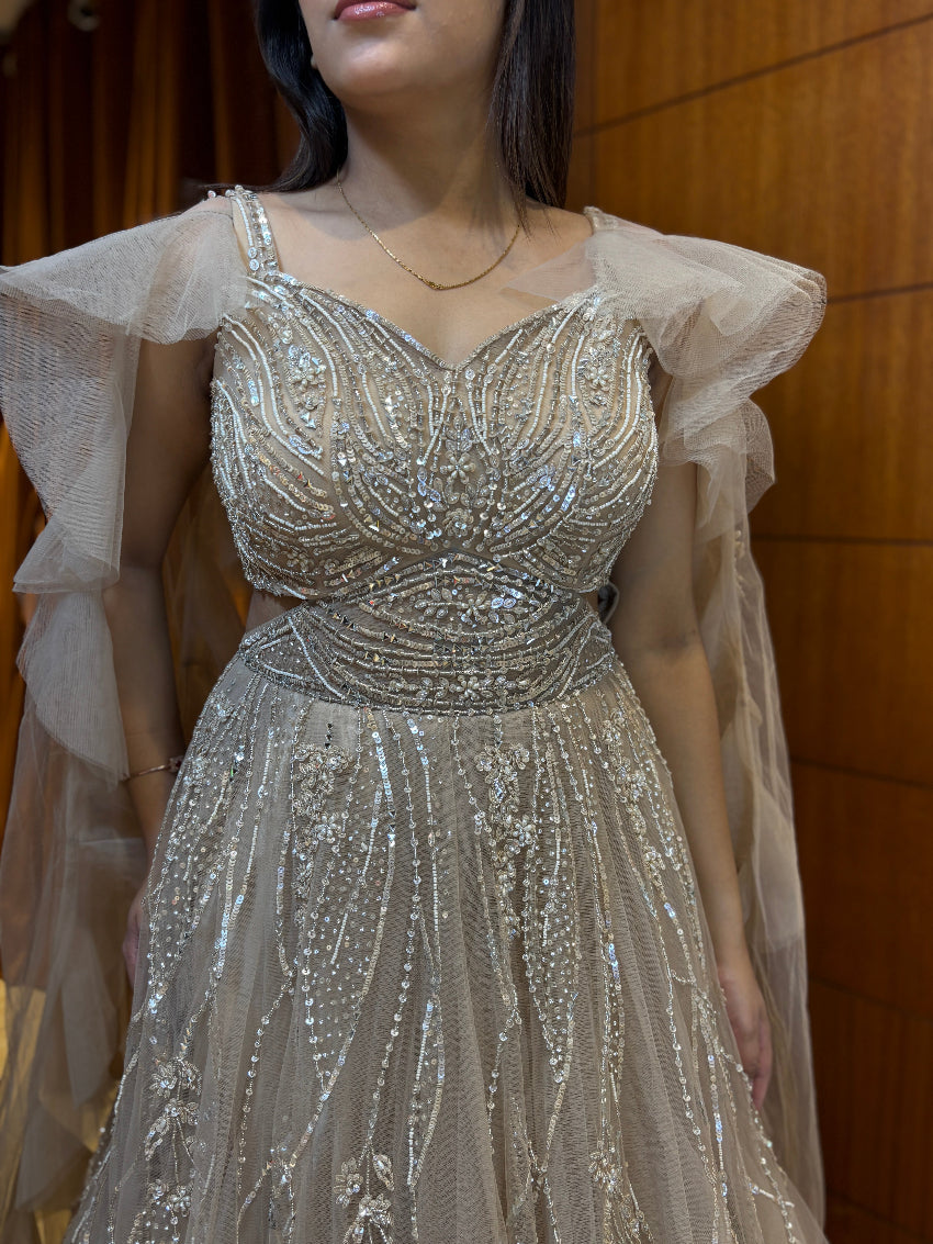 Champagne gold premium hand-embellished engagement gown with ruffle cape style sleeves and rope tie backless pattern