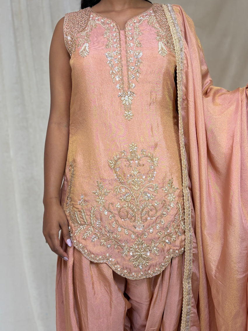 Pink embroidered traditional outfit with a matching dupatta on a plain background