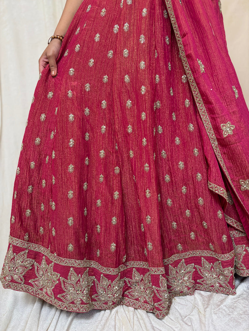 Red traditional outfit with gold embroidery on a white background