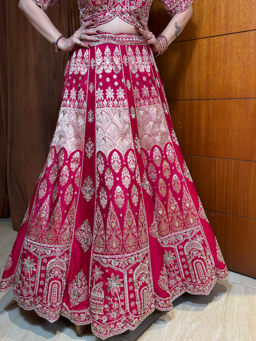Red and white embroidered traditional outfit on a wooden floor