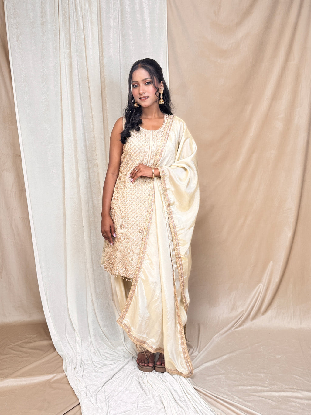 Champagne gold straight kurta set with intricate hand embroidery of beads, Zari, sequin and kut Dana with designer salwar and lace dupatta