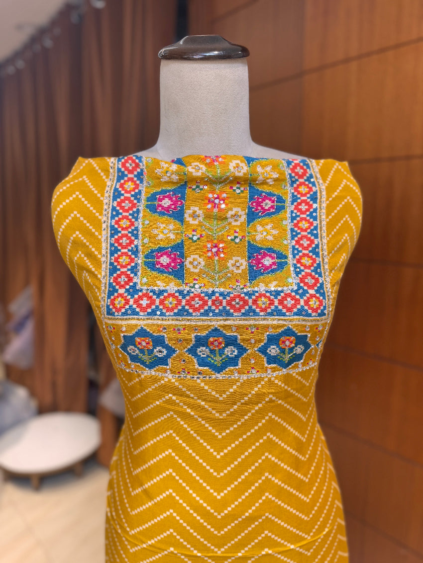 Yellow crepe silk printed suit with handwork detailing on neck