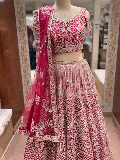 Rani pink Heavy Embroidered lehenga with mirror and sequin detailing