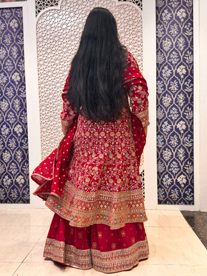 Red Heavy embroidered Anarkali with sharara and hand work detailing