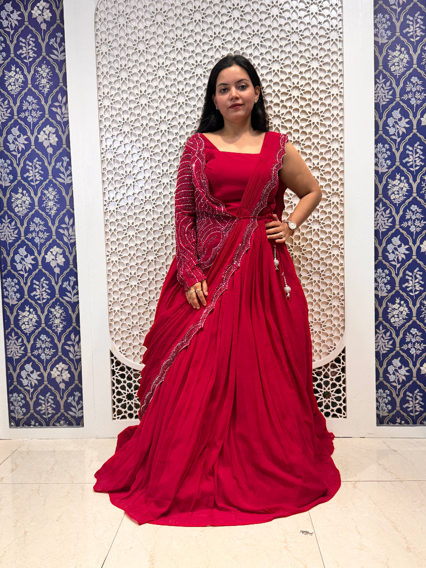 Woman wearing a red saree with a white background