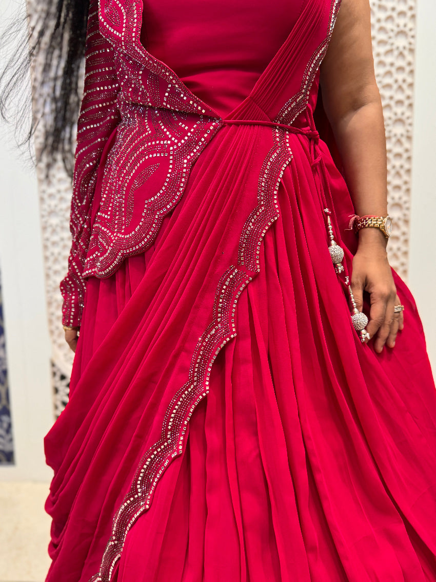 Red indo western gown with drape saree pattern and one side heavy jacket and sleeve