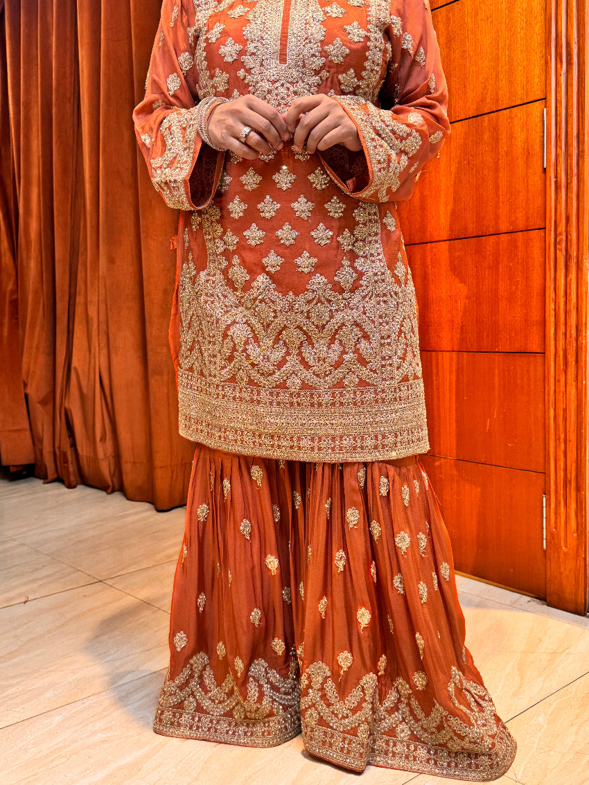 Rust orange heavy gharara suit set with intricate detailing