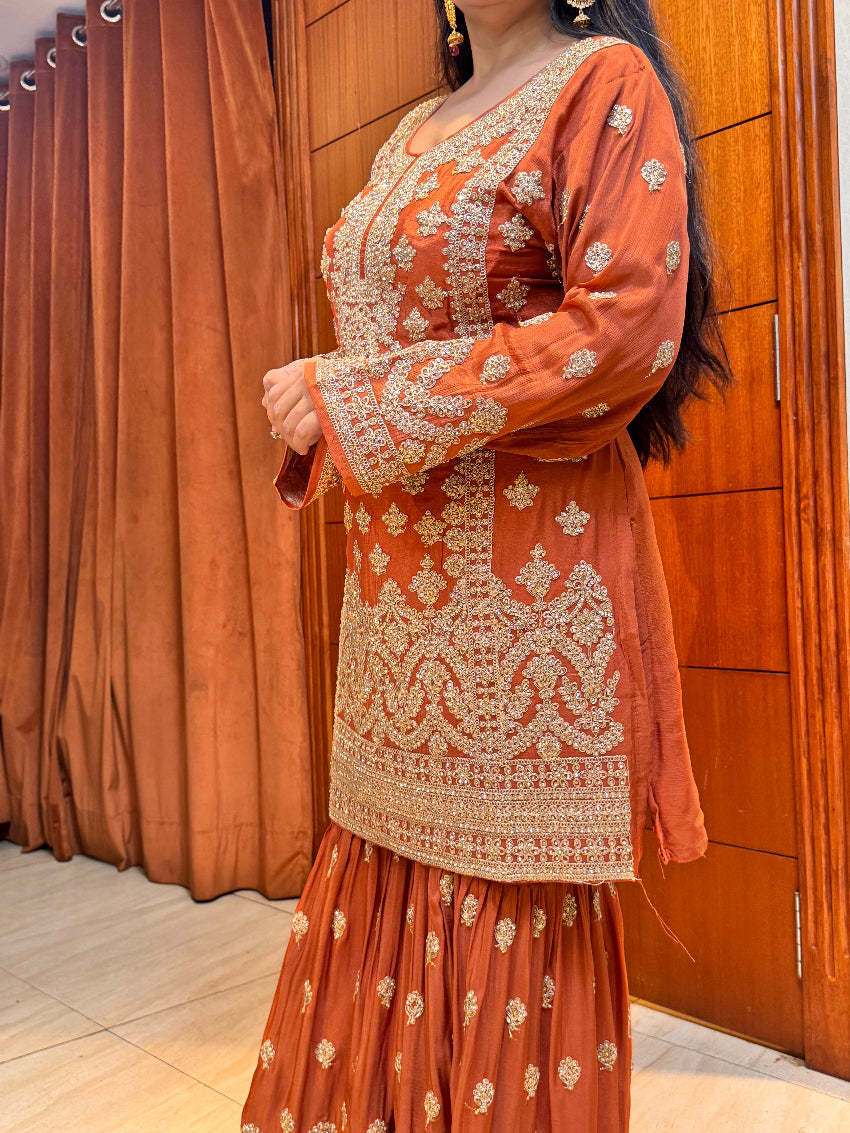 Rust orange heavy gharara suit set with intricate detailing