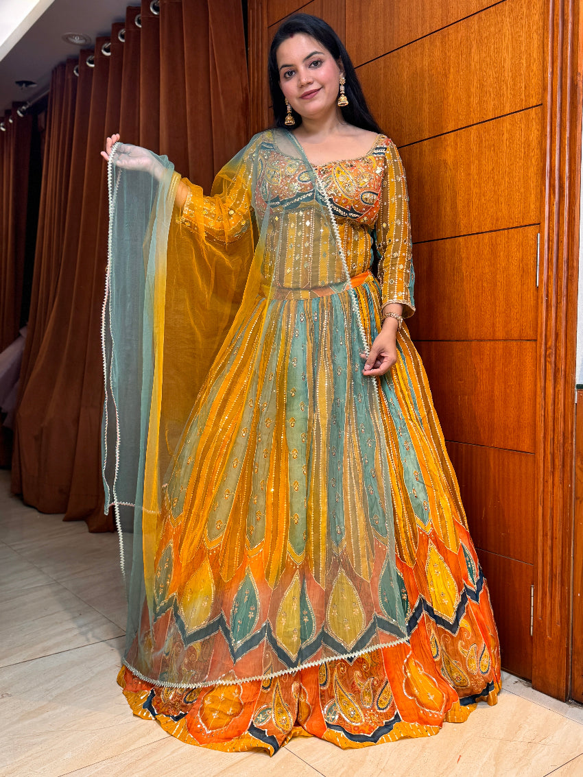 Woman in a colorful traditional outfit standing indoors with wooden paneling.