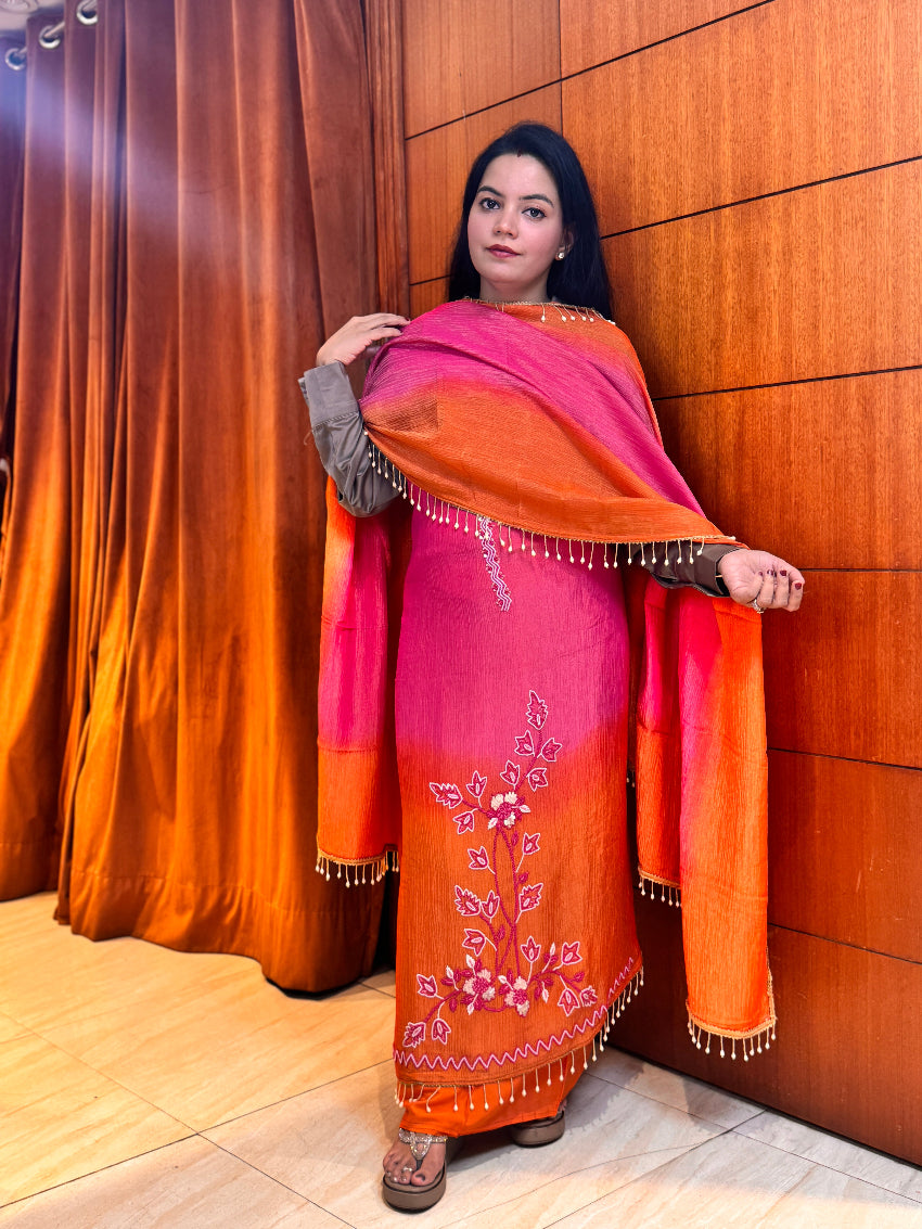 Woman holding a traditional stringed instrument against a wooden wall
