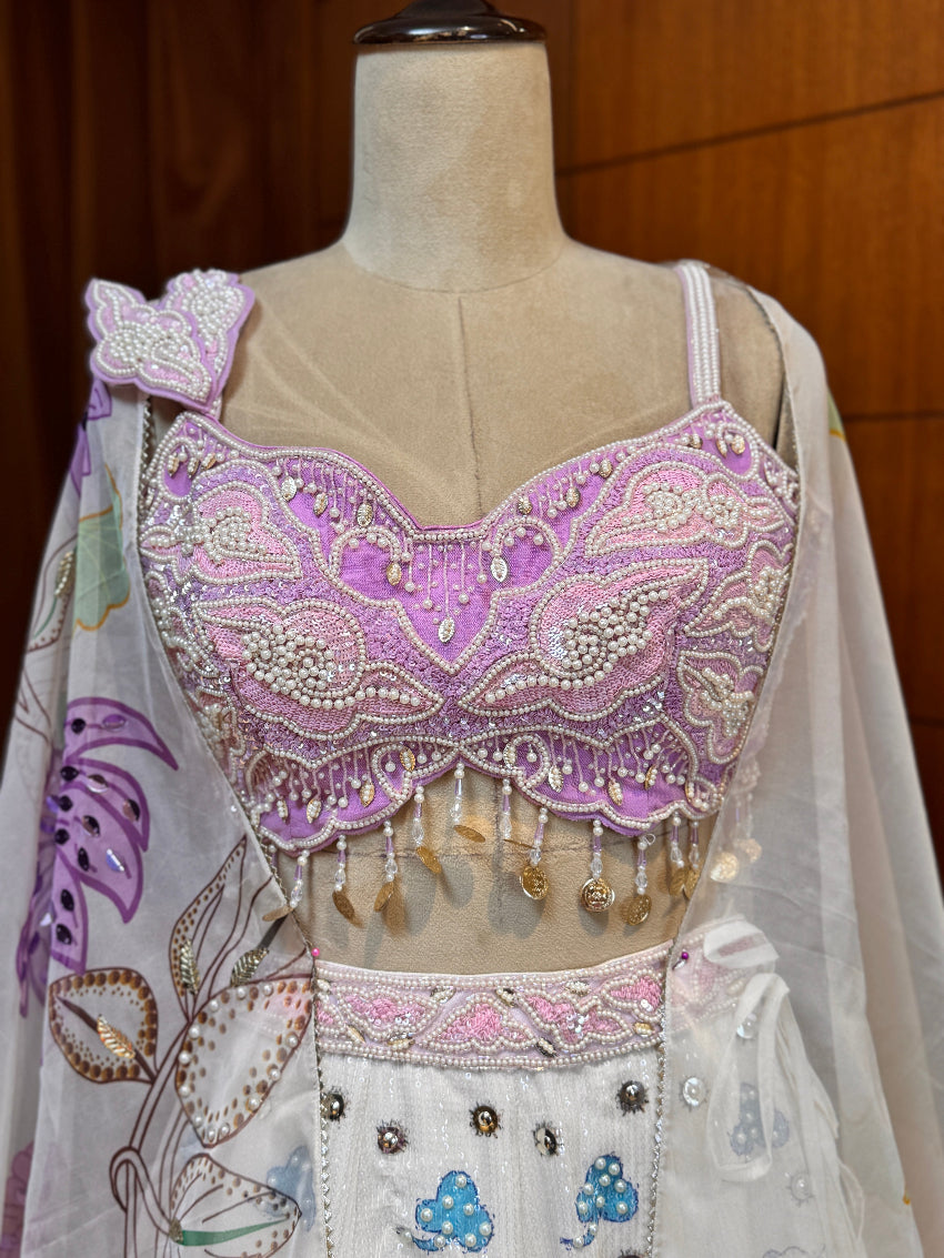 Embroidered blouse on a mannequin with a floral design