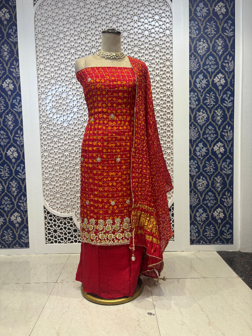 Red bandhej suit with intricate gota detailing