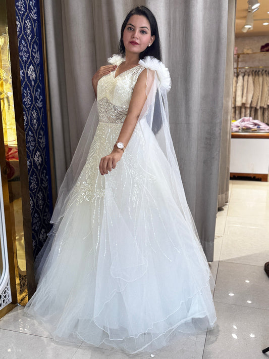 Ivory ball gown with designer hand embroidery and long net cape sleeves with frill shoulder