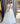 Ivory ball gown with designer hand embroidery and long net cape sleeves with frill shoulder
