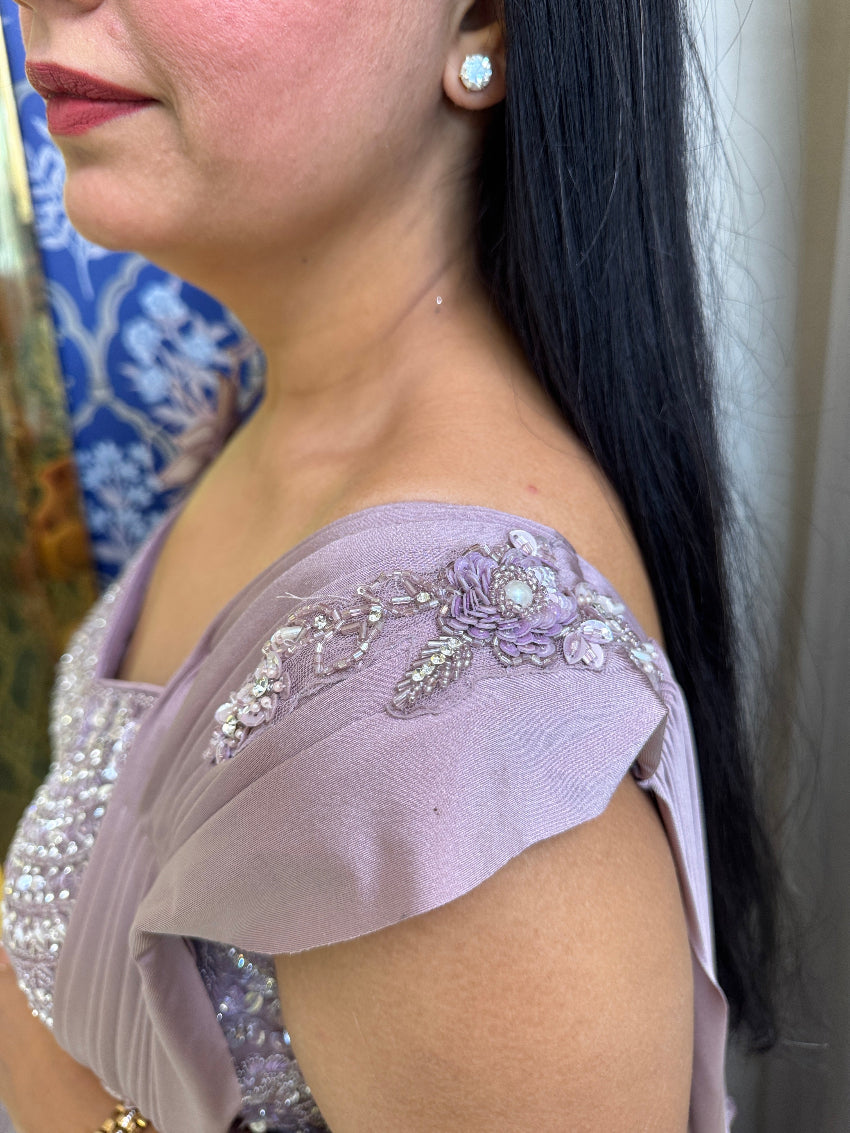 Purple color  fish cut lehenga with layers and hand embroidered blouse with tassels