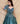 Turquoise Blue party wear gown in cosmos fabric and detailed with stones, cutdana and sequin.