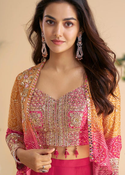 Woman wearing a traditional outfit with pink and orange colors against a beige background