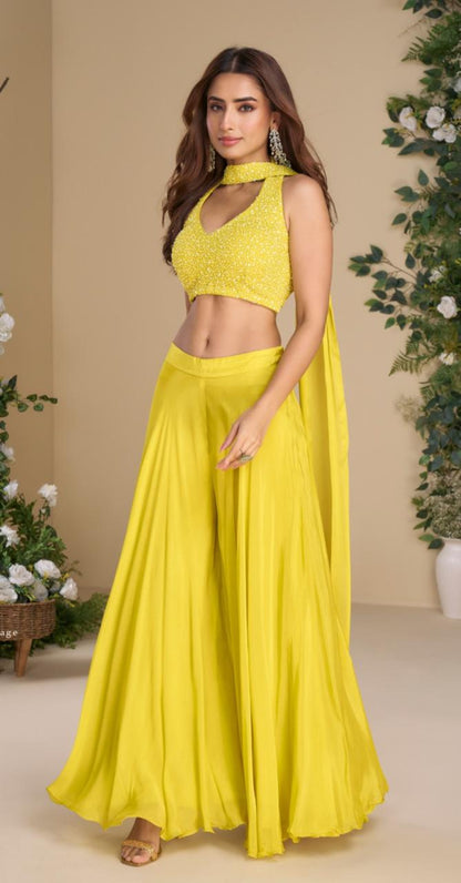 Woman wearing a yellow outfit with a beige background